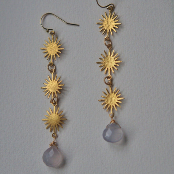 long gold sunburst earrings with chalcedony stones