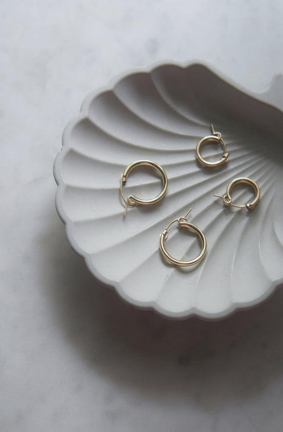 two sizes gold hoops in shell